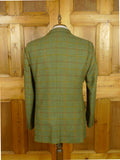 26/0822 musto performance green wp check tweed shooting jacket w/ action back 44 regular to long